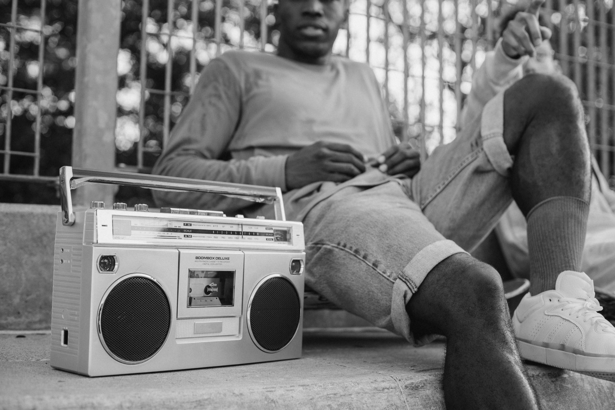 person sitting with a radio to illustrate radio is not dead in South Africa