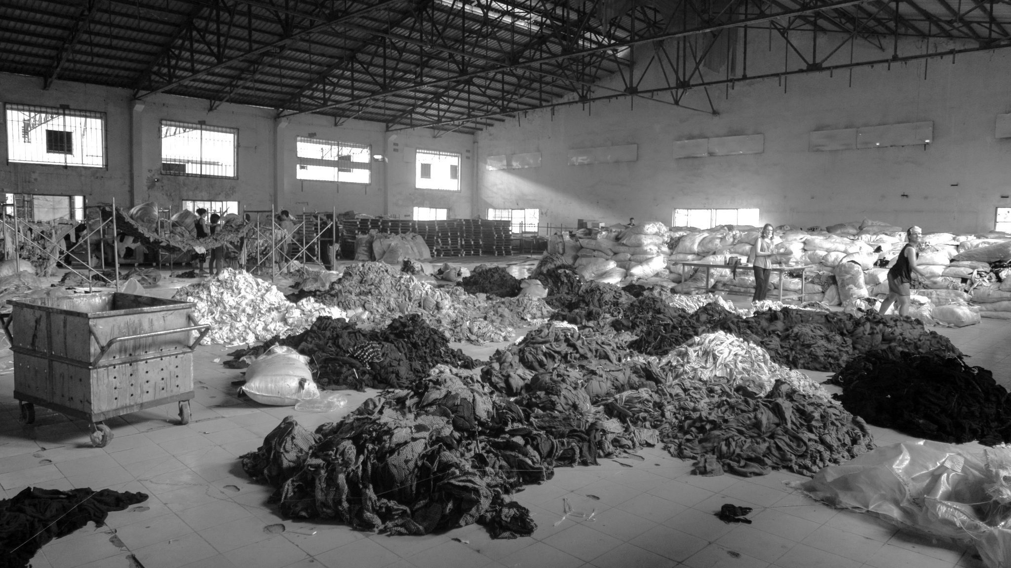 piles of clothes in factory illustrating the fast fashion comeback in South Africa